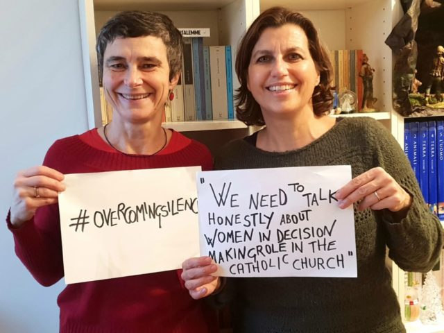 Ladies Holding Posters